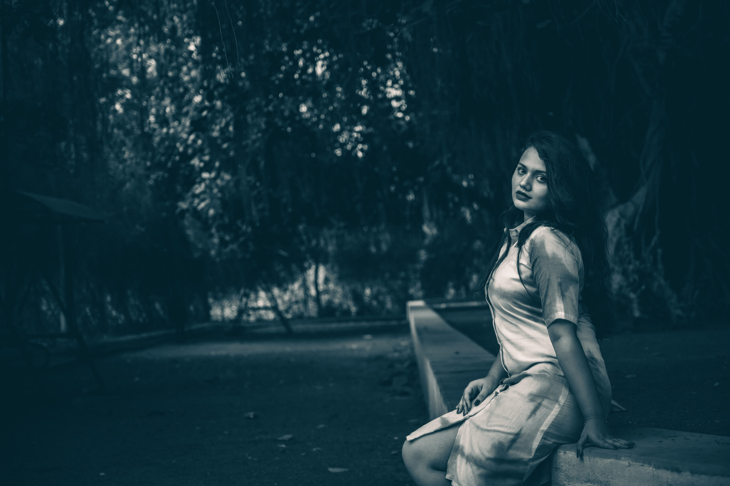 Fashion Photography - Girl sit near tree and shadows in her face