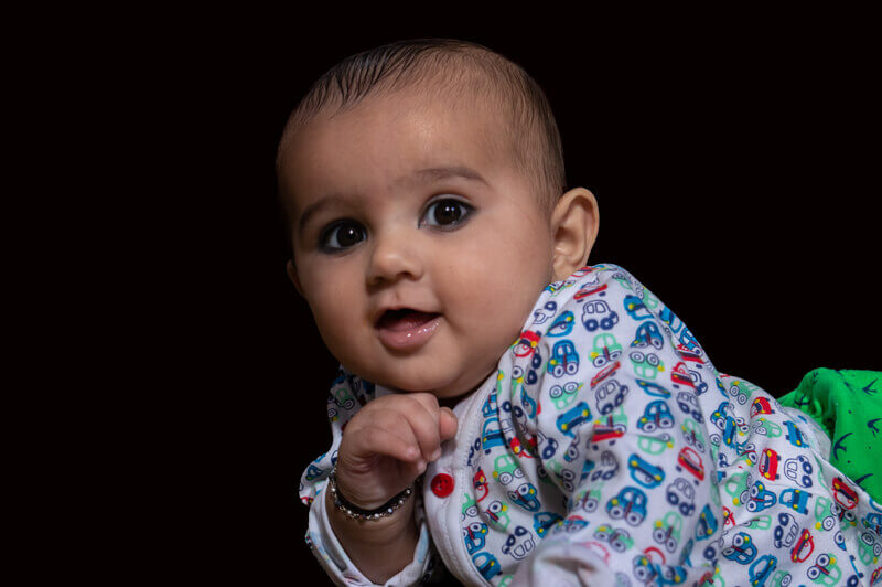 little baby posing in front of camera